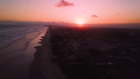 beautiful flying over waves in ocean beach in brazil, aerial shot