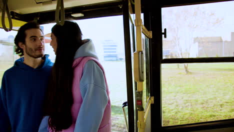 young people getting on the bus