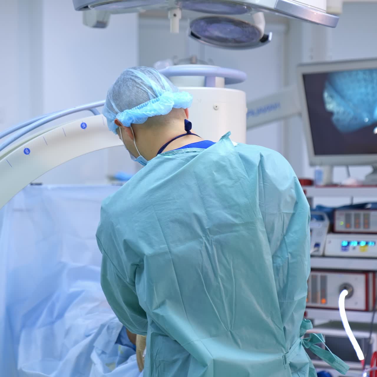 Process of trauma surgery operation. Group of surgeons in operating room with surgery x-ray equipment