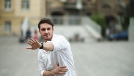 Cheerful-man-dancing-at-street-in-slow-motion.-Happy-businessman-celebrating