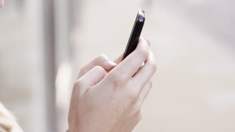 closeup woman hands using touchscreen tablet smartphone device