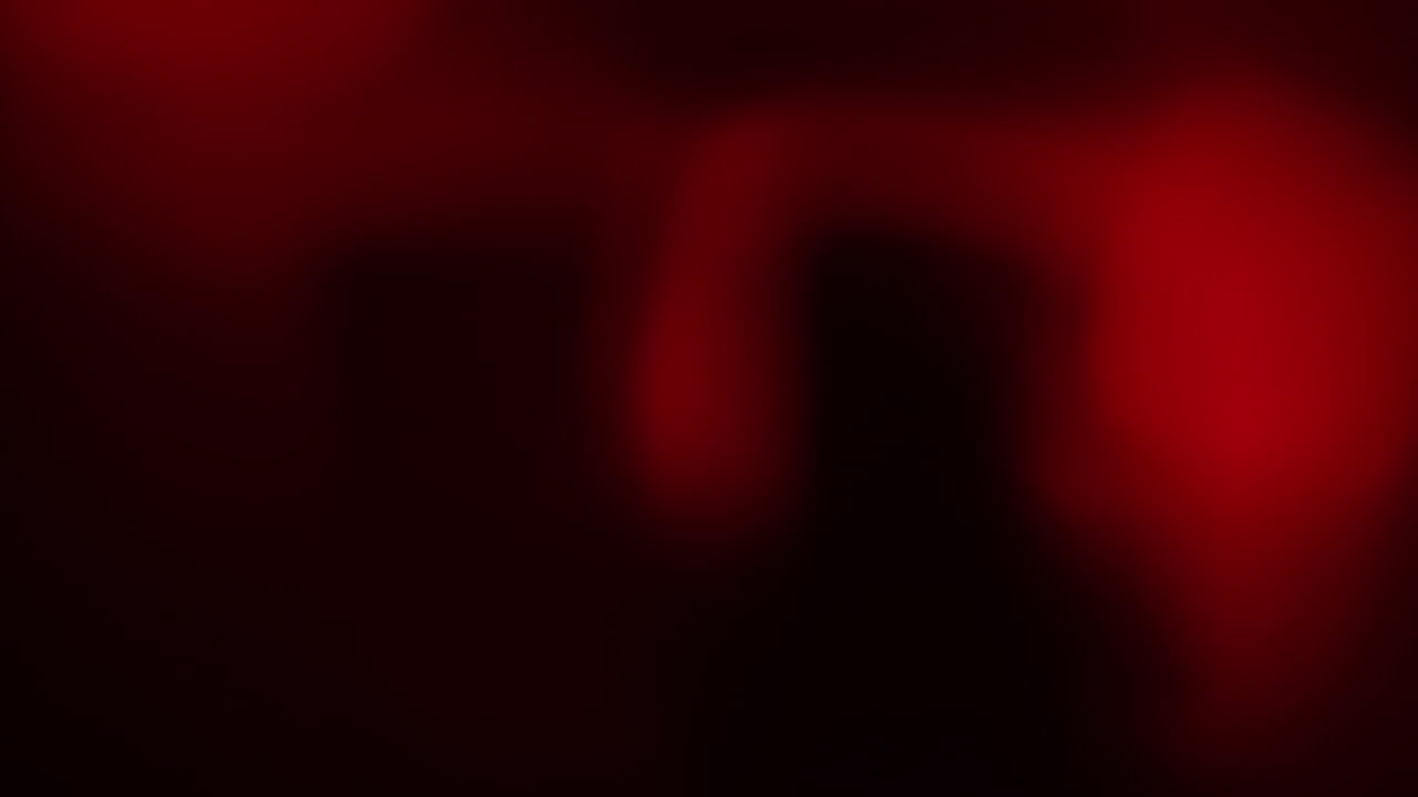 Abstract red gases swirl slowly in dark space, resembling plasma or cosmic ether. Perfect for VFX, sci-fi overlays, projection art, or experimental film textures with a galactic atmosphere.