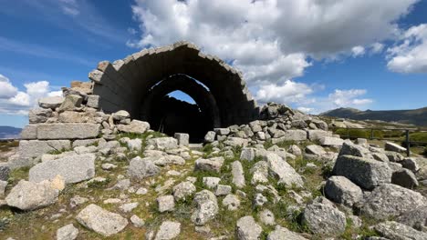 filming-of-the-hermitage-of-San-Pedro,-14th-century,-seeing-its-degradation-with-many-stones-on-the-ground,-there-are-those-spectacular-vaults-and-the-complex-has-a-perimeter-fence-sky-with-clouds