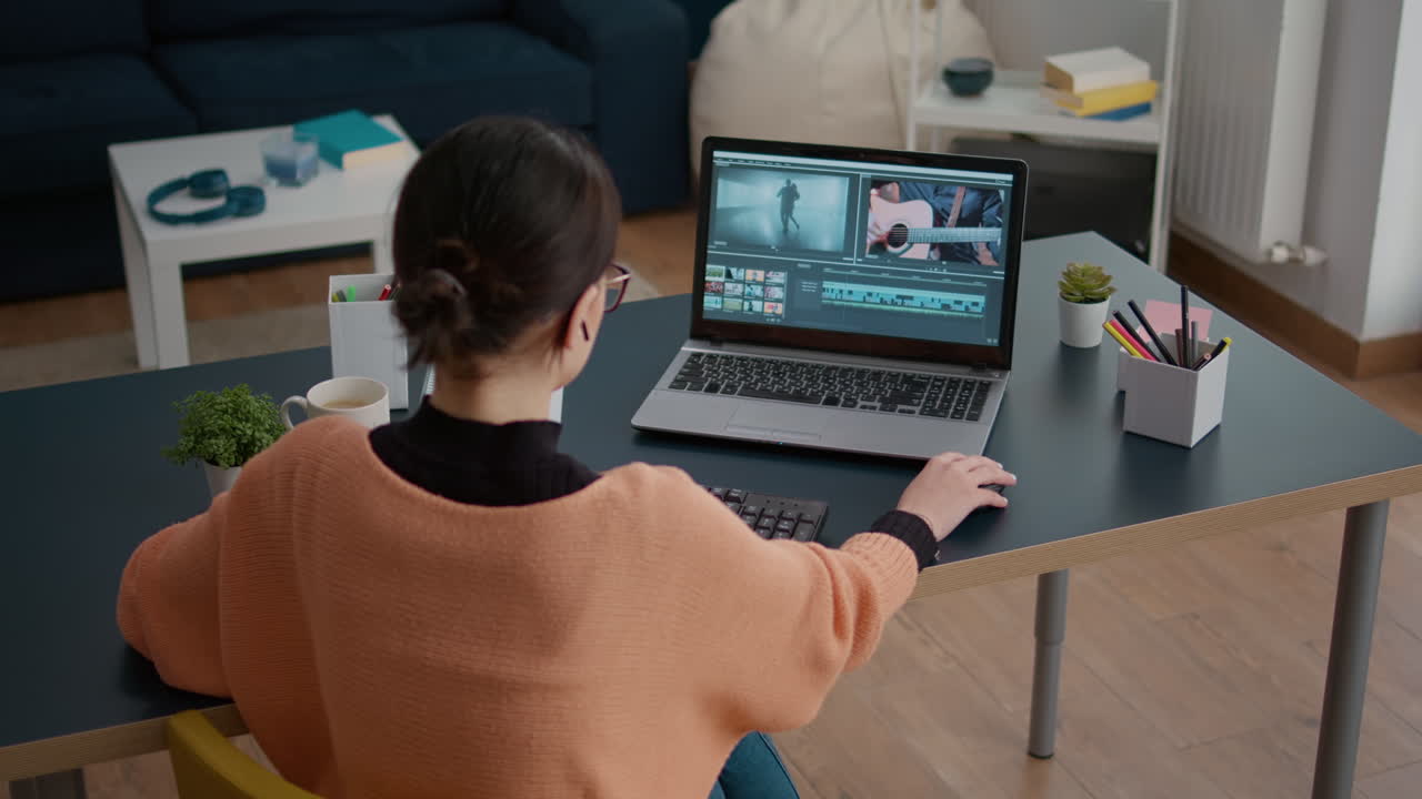 Female colorist working on video footage design with multimedia software