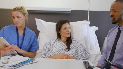 female patient and medical staff in consultation at hospital