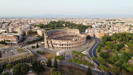 ancient roman colosseum dominates rome skyline during golden hour flight, italy