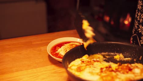 delicious beans on the table topped with scrambled eggs in the kitchen