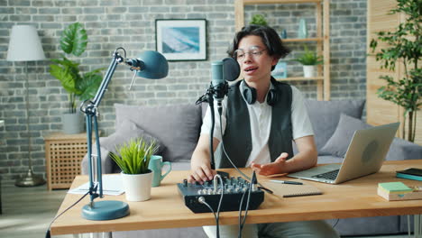 teenager podcaster recording a podcast at home