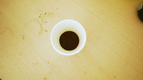 black coffee, pouring boiling water into a glass with black coffee