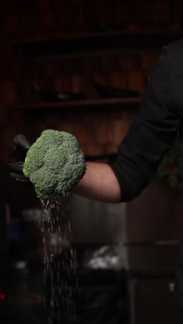 chef washing broccoli