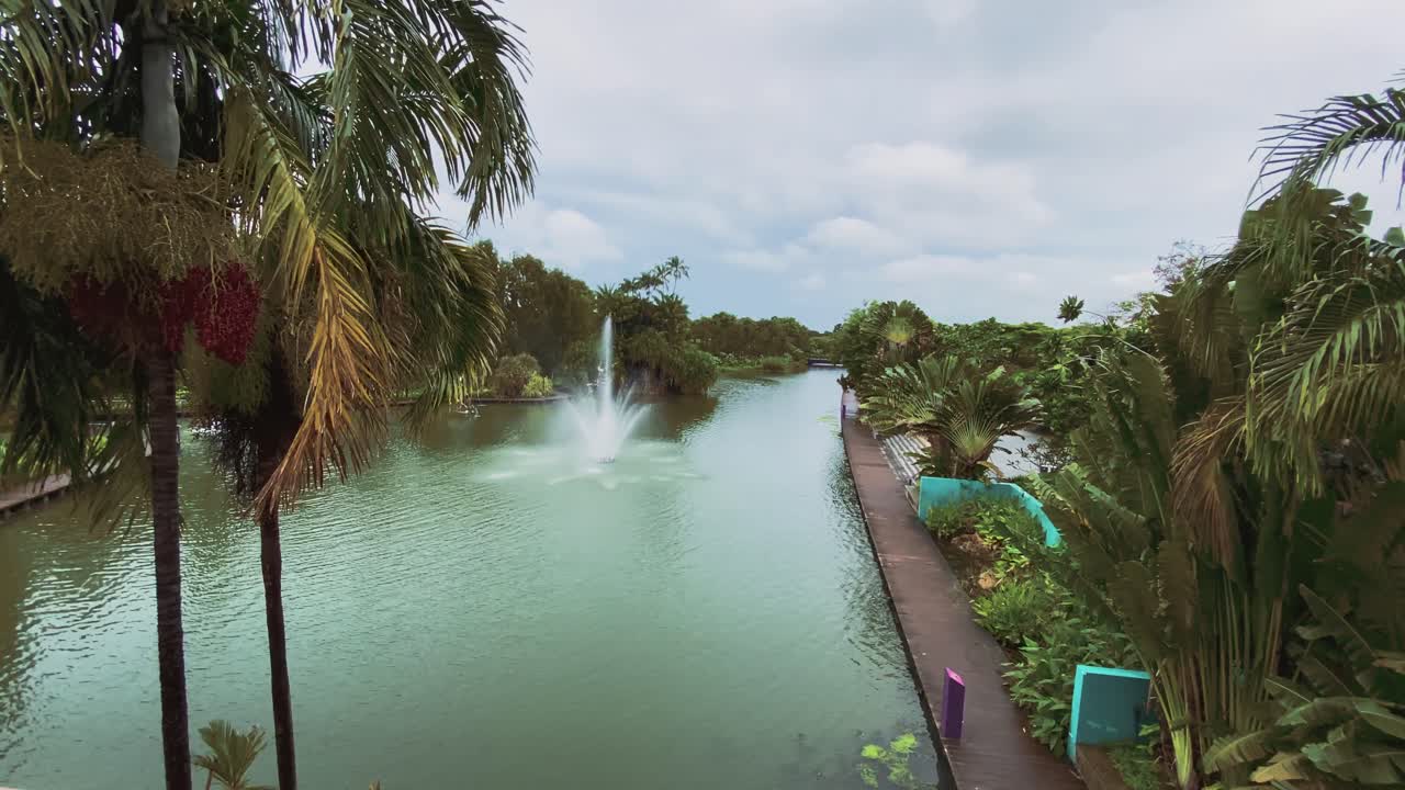 Beautiful Fountain In The Middle Of The Lake At The Gardens By The Bay In Singapore - wide shot
