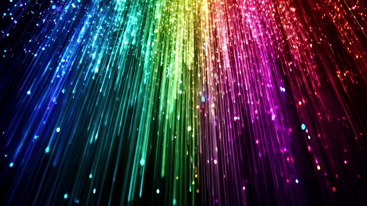 Vibrant rainbow light streaks cascade downwards, captured from a low angle