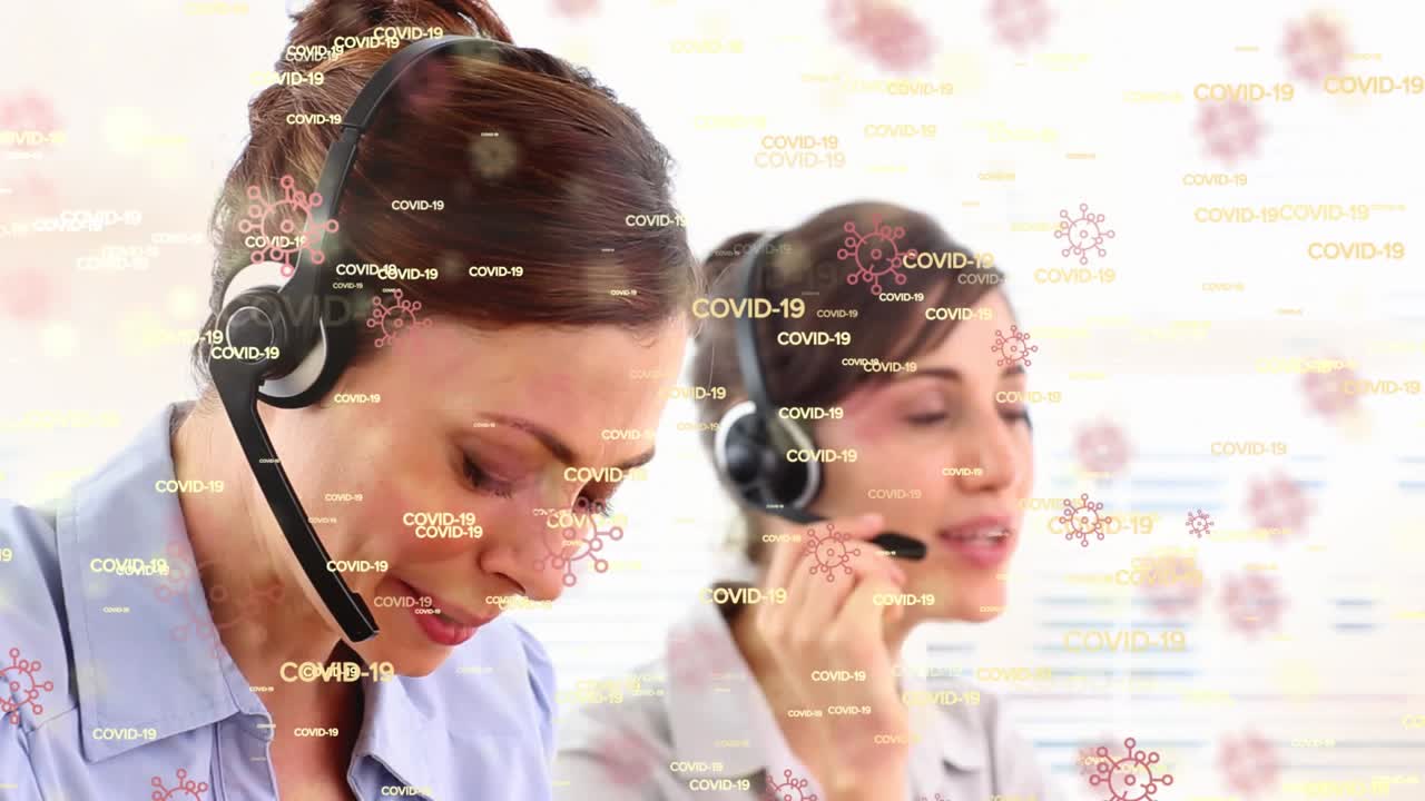 Animation of covid 19 text with virus cells over diverse business people using phone headset