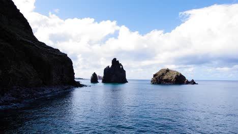 flying low along cliffs over the ocean in madeira island