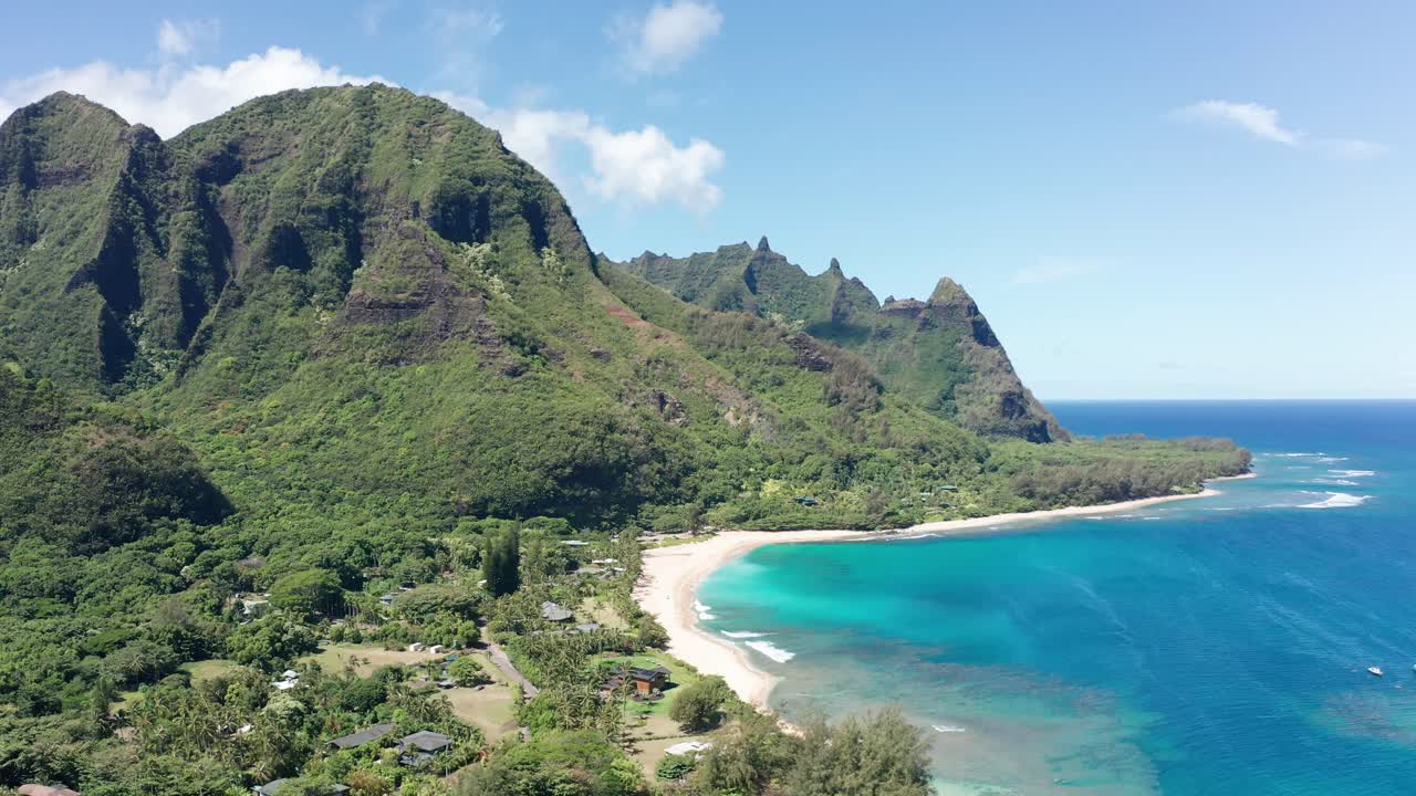 Wide panning aerial shot of picturesque Haena Beach on the island of Kaua'i, Hawai'i