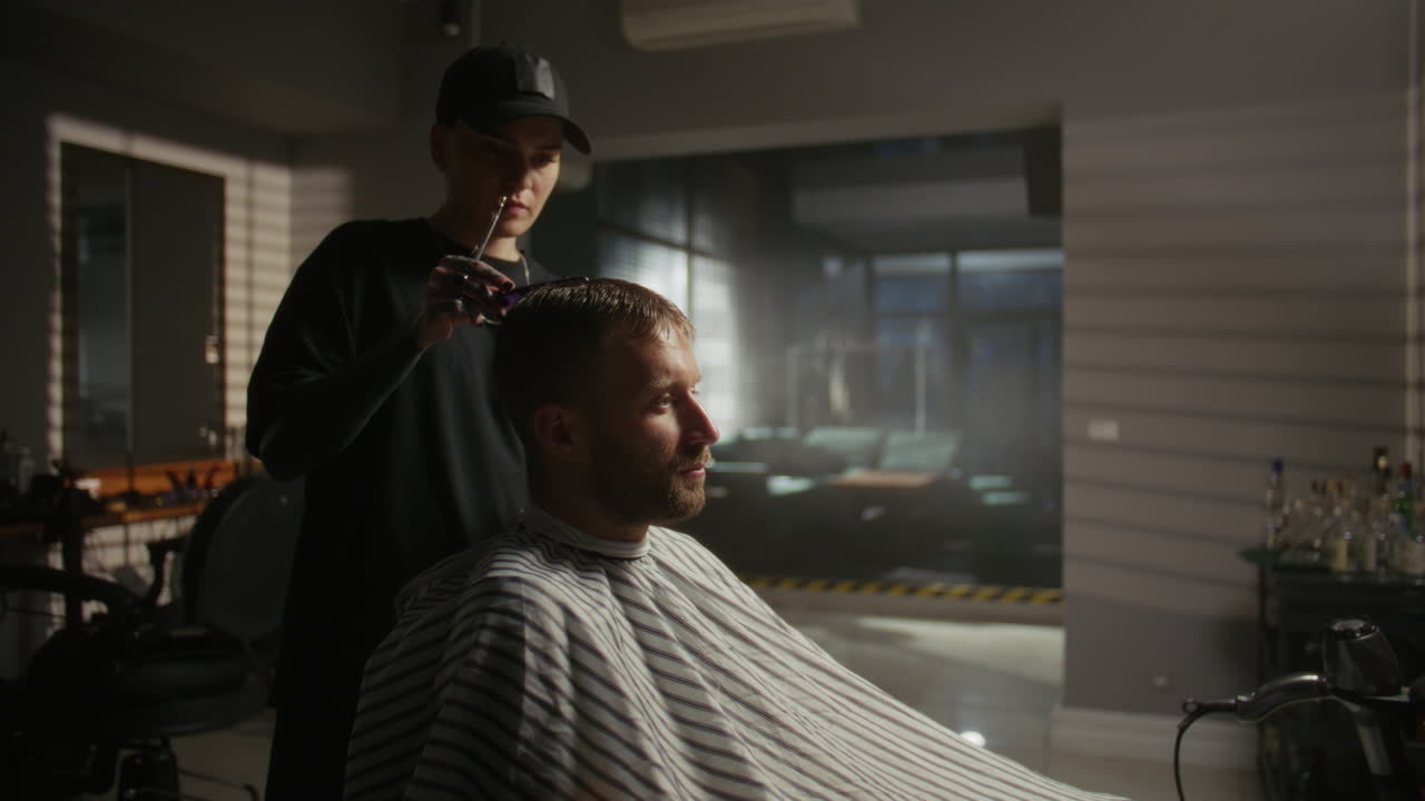 Barber giving a haircut in a modern salon