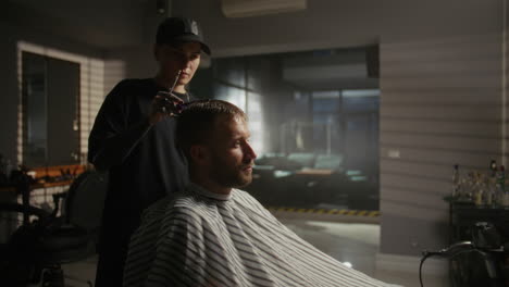 barber giving a haircut in a modern salon