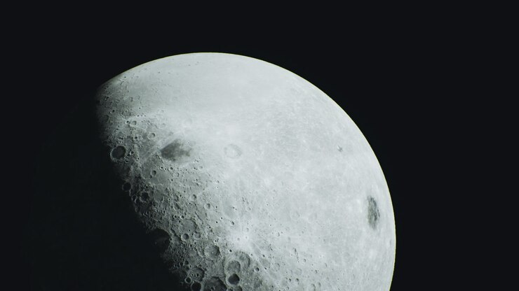 Glimpse of the moon highlighting its craters and surface details at night