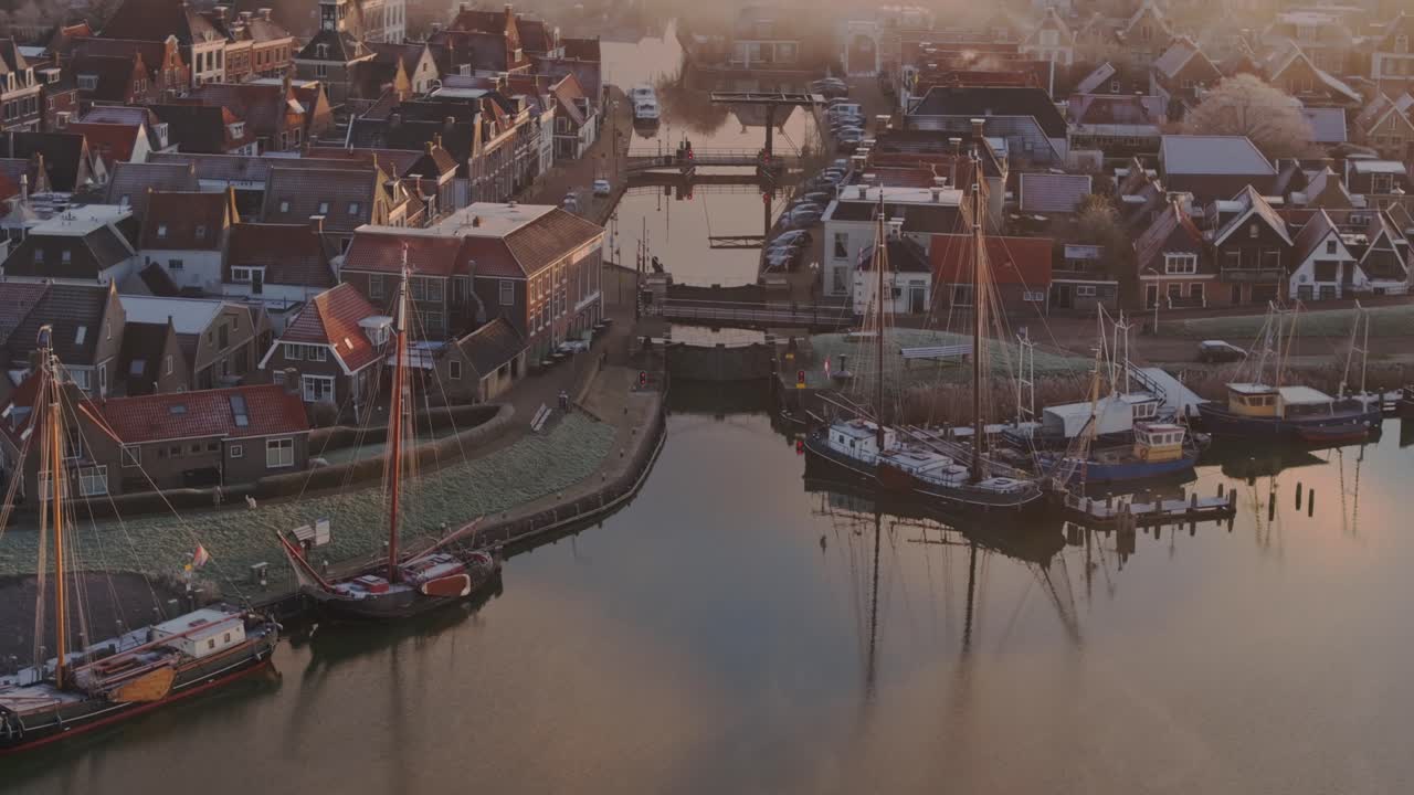 Reveal shot of Makkum Friesland during foggy morning, aerial