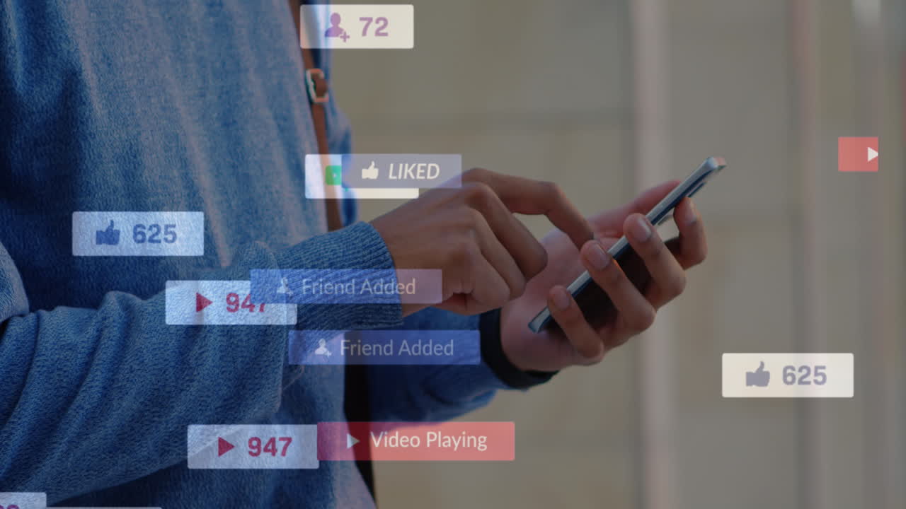 Animation of social media icons floating against mid section of man using smartphone