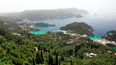 aerial drone shot over the picturesque rocky coastline of paleokastritsa bay in corfu, greece