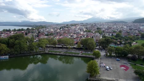 ioannina old town and city center aerial panoramic view, pamvotis lake, epirus greece, panning shot