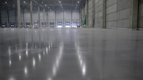 empty warehouse with polished concrete floor under construction