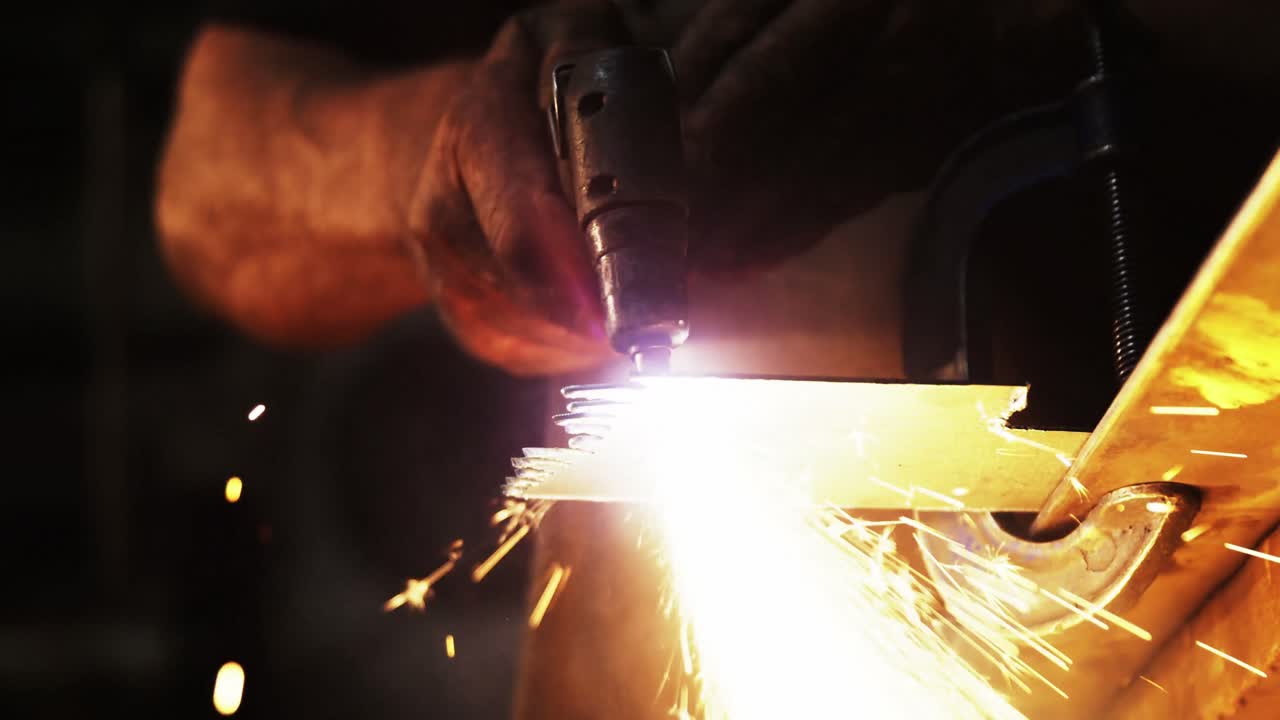 Mid-section of welder using welding torch