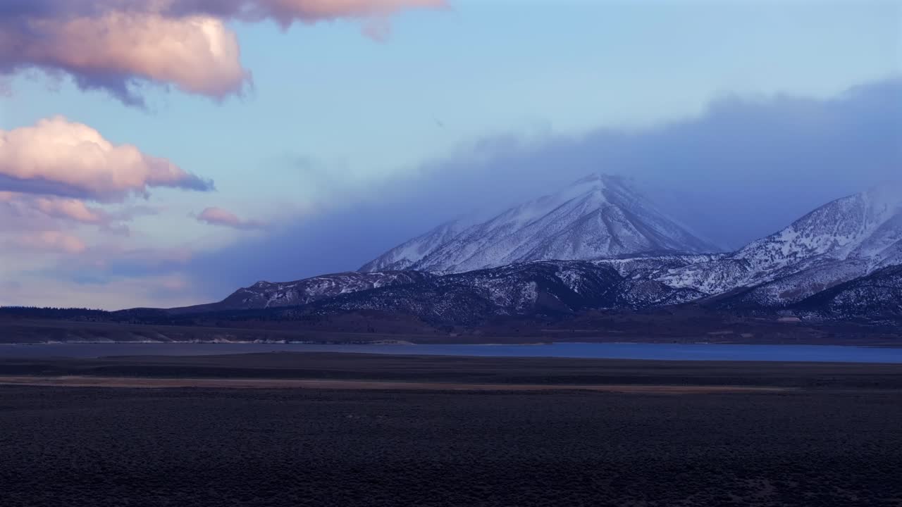 Mammoth LakesToms Place Convict Canyon Minarets Sierra Nevada mountains Hilltop Wild Willy's Hot Springs California aerial drone Benton Crossing Long Valley Caldera winter sunset clouds upwards