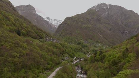 Aerial-establishing-dolly-of-Verzasca-Valley-and-village-in-the-mountains