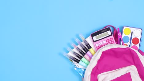 backpack appear on blue theme and school stationery appear from backpack. stop motion