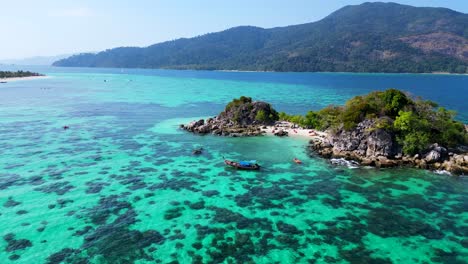 beach rocky cliff island turquoise blue sea