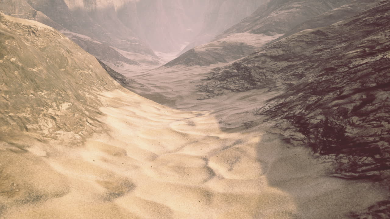 Vast desert landscape with rolling dunes and distant mountains at sunset