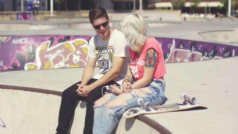 Man-chatting-to-his-girlfriend-at-a-skate-park