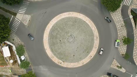 roundabout with anticlockwise traffic during daylight with portuguese sidewalk in lisbon