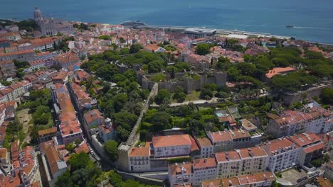 aerial drone shot of castle sao jorge with national pantheon and alfama in background in lisbon at sunny morning