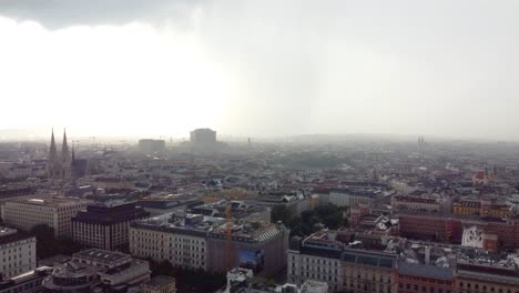 rain clouds flowing above vienna city, aerial drone view