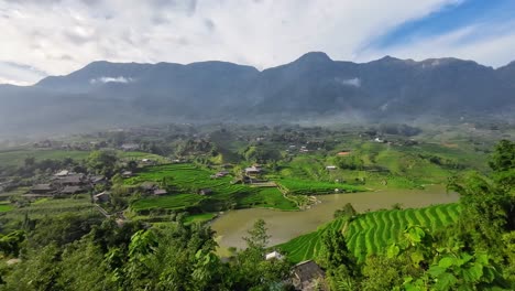 detailed footage of rice terraces in sapa, vietnam, highlighting vibrant green fields, rural farmland, and mountain scenery during farming season