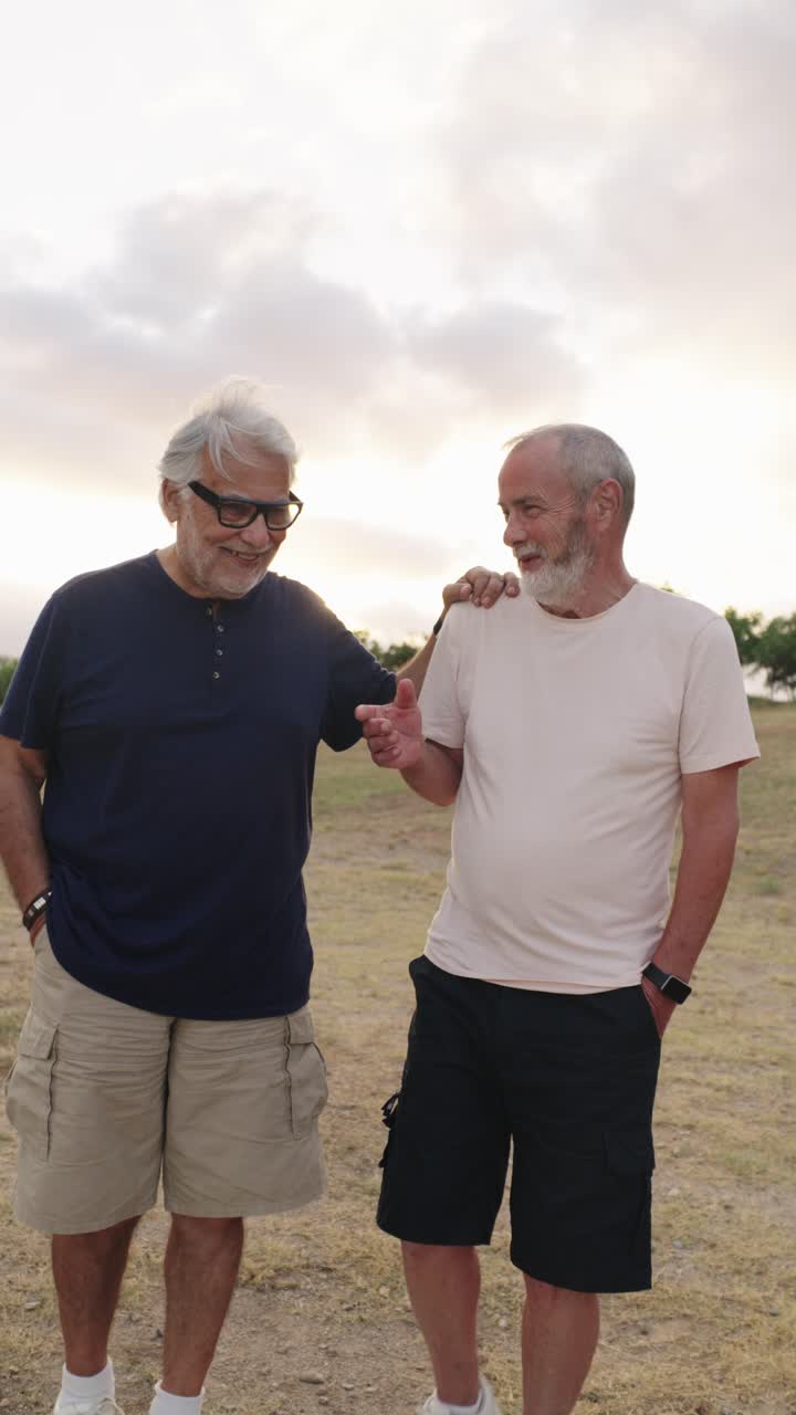 Two older men having a friendly chat outdoors