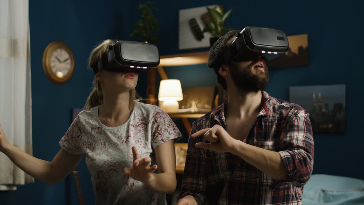 Couple enjoying virtual reality experience at home