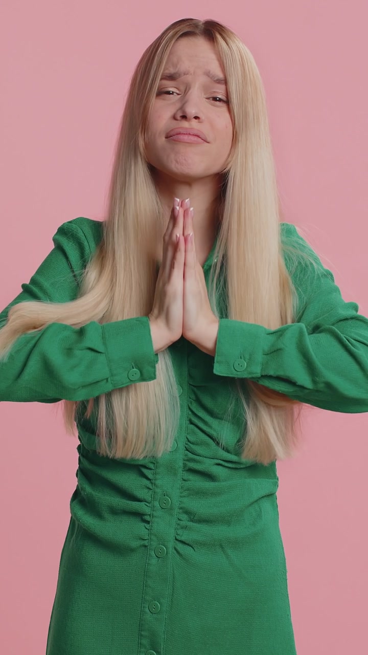 Young lady showing a little bit gesture with sceptic smile showing minimum sign measuring small size