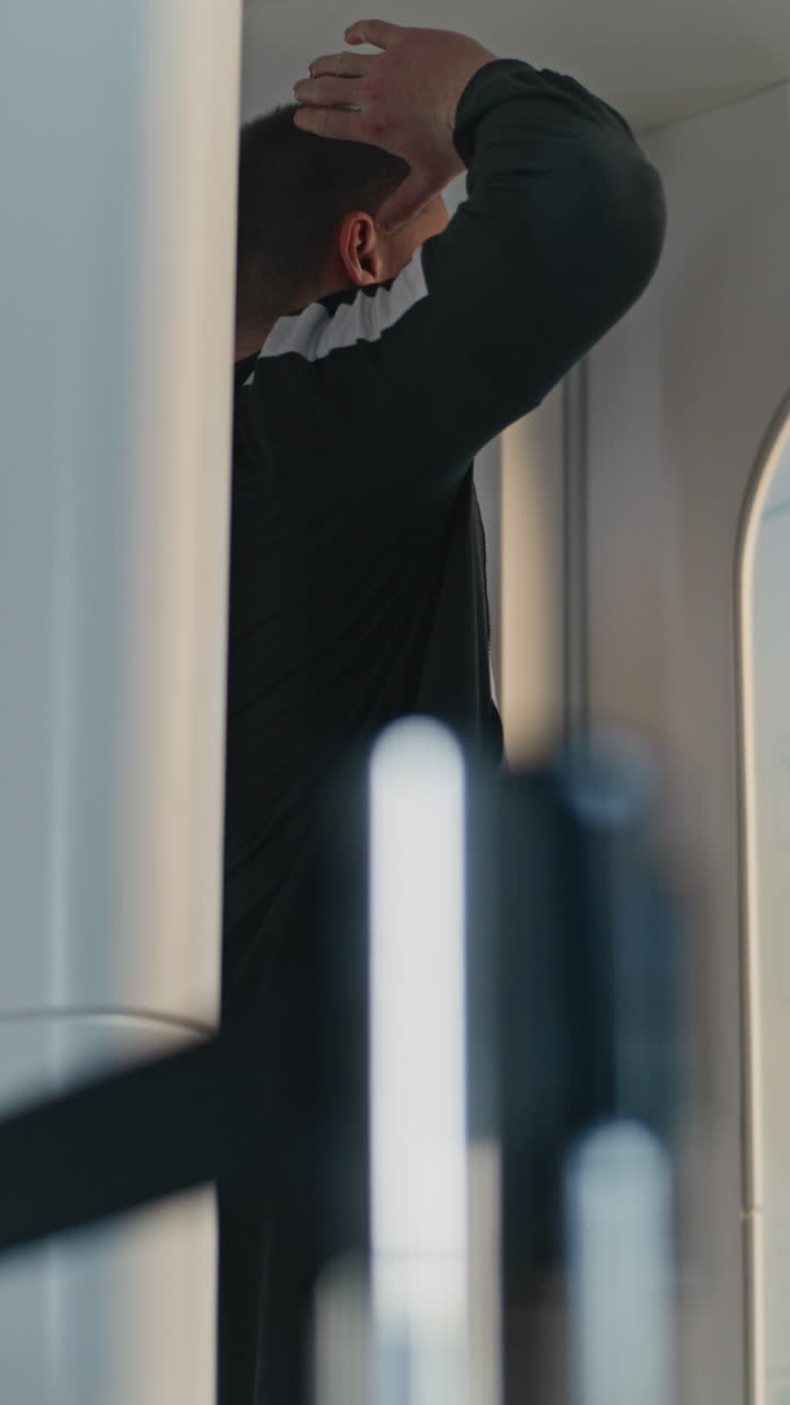 Man Grooming and Woman Walking in Airport