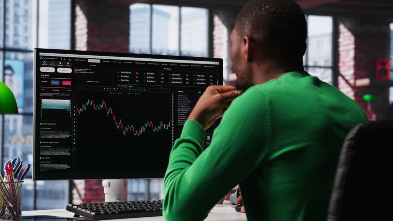 Vertical Video Day trader uses computer to purchase stocks that might perform well