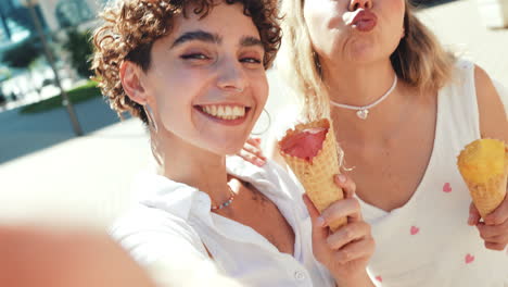 happy friends enjoying ice cream in the city