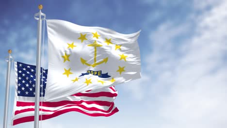 the rhode island state flag waving along with the national flag of the united states of america