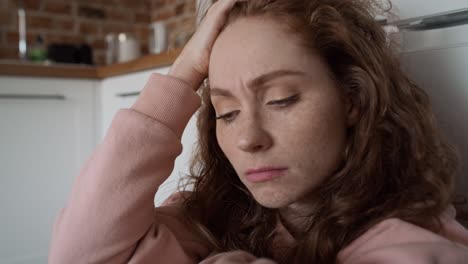 close up of thoughtful young caucasian woman