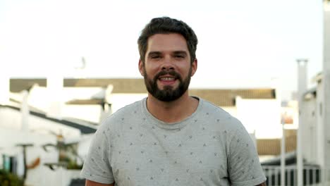 handsome bearded man looking at camera