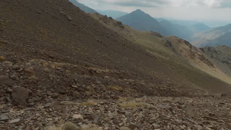 Glacier-corridor-excavated-into-the-rocky-mountain-ground-in-High-Atlas,-Morocco