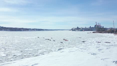 drone shot, slow pan backward of ice canoeing race