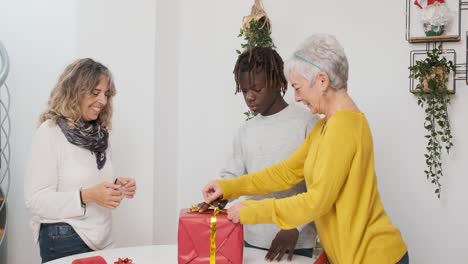 family wrapping gifts together
